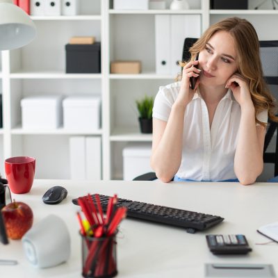 A charming young girl in both a white blouse and with beautiful locans. photo with depth of field
